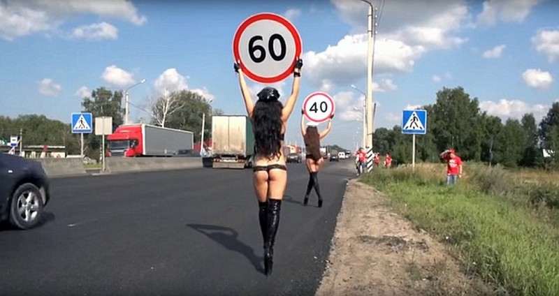 Topless Women Carry Speed Limit Signs For Road Safety Campaign in Russia 